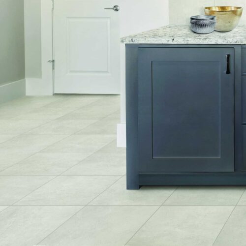 Arenella Off-White, ivory twelve by twelve inch stone look ceramic tile, installed on a kitchen floor